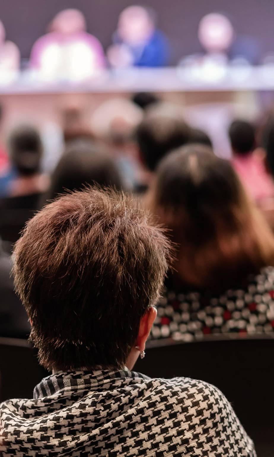 Rear view of Audience in the conference hall or seminar meeting which have Speakers are Brainstorming